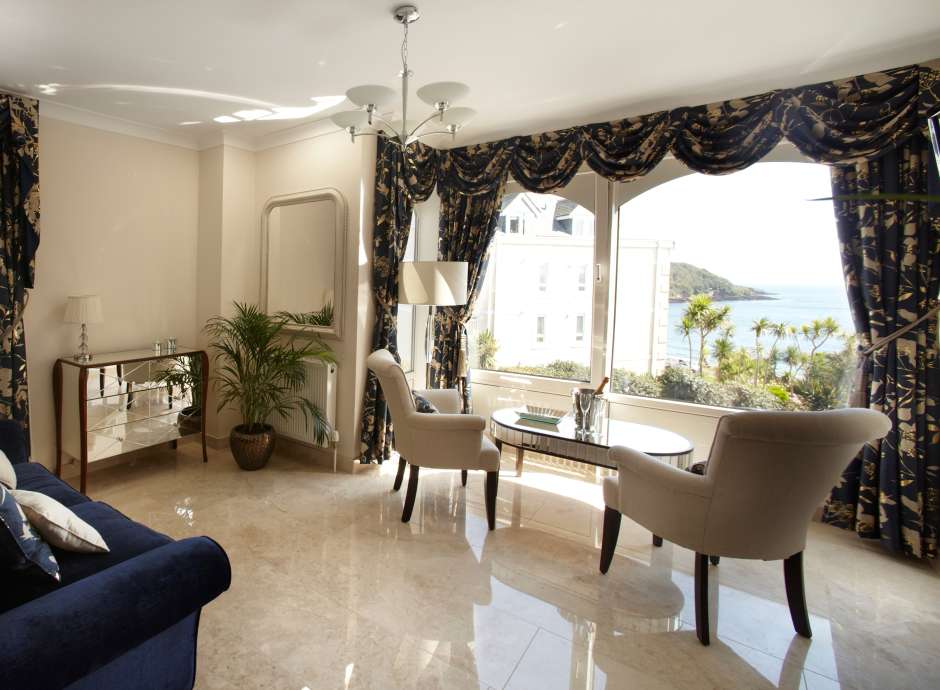 The luxurious lounge of the Armada Suite with sea view at The Royal Duchy Hotel in Cornwall