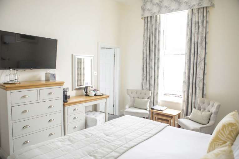 Royal Duchy Hotel Standard Sea View Room (117) Bedroom with Desk and Seating Area