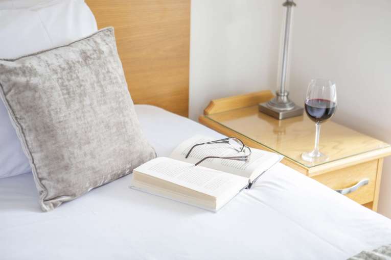 Royal Duchy Hotel Single Room Accommodation Guests Book and Glass of Wine