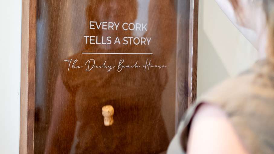 Lady dropping cork at The Royal Duchy Hotel