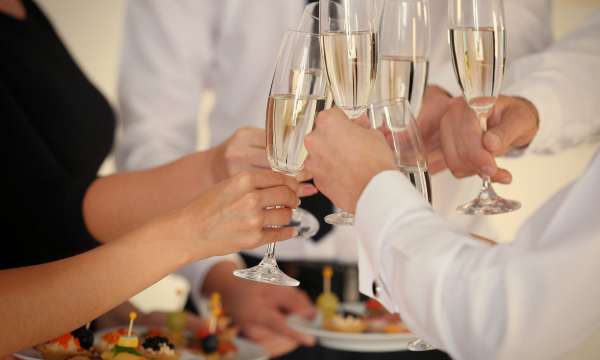 Wedding guests making a toast with champagne