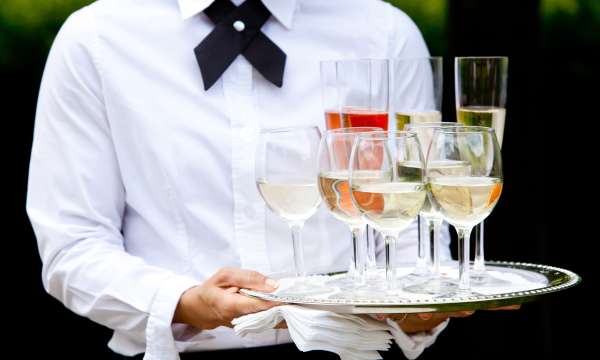 Waiter with a tray of wine at a wedding reception