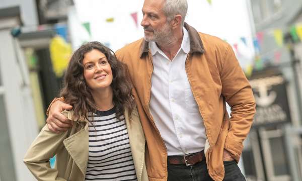 Couple walking down street