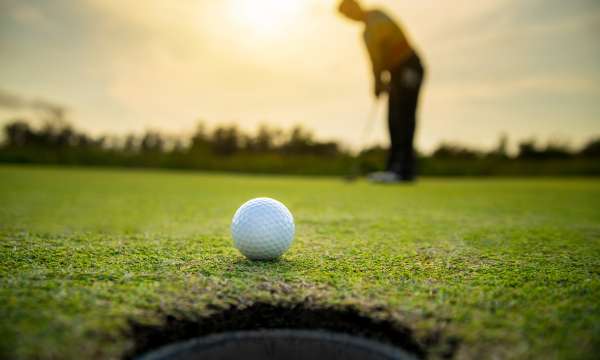 Close up of a golf ball on a green