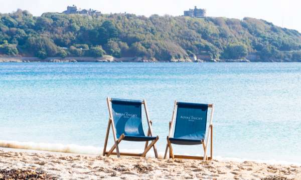 Deckchairs on Gylly beach in Falmouth, Cornwall