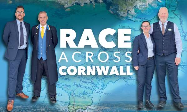 Staff at The Royal Duchy Hotel and The Carlyon Bay next to the Race Across Cornwall Text 