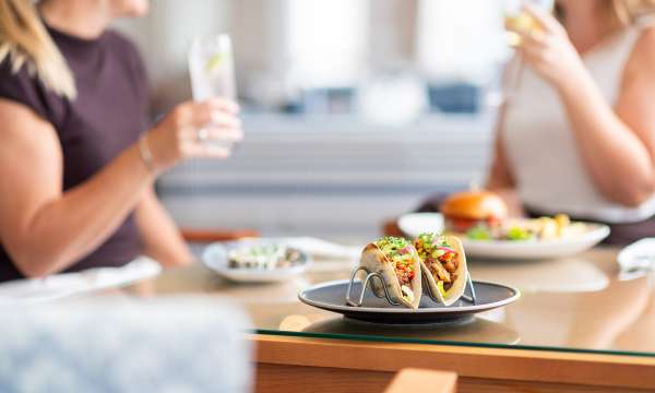 Tacos with ladies drinking in the background The Royal Duchy Hotel