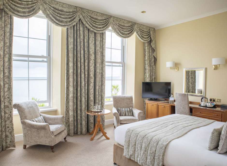 Royal Duchy Hotel Deluxe Sea View Room First Floor Accommodation Bedroom with Seating and Desk