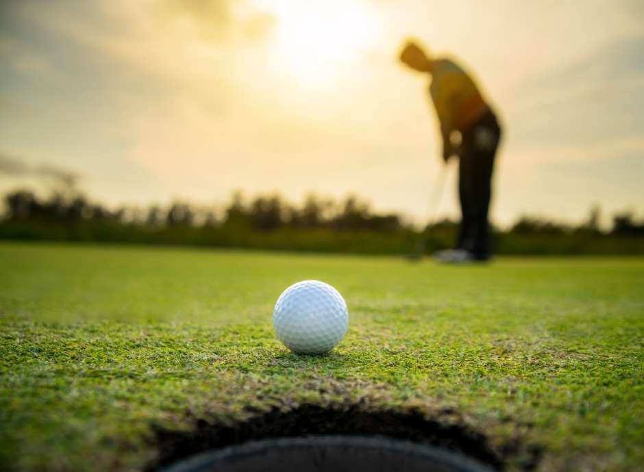 Close up of a golf ball on a green