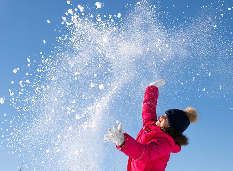 Child playing in the snow