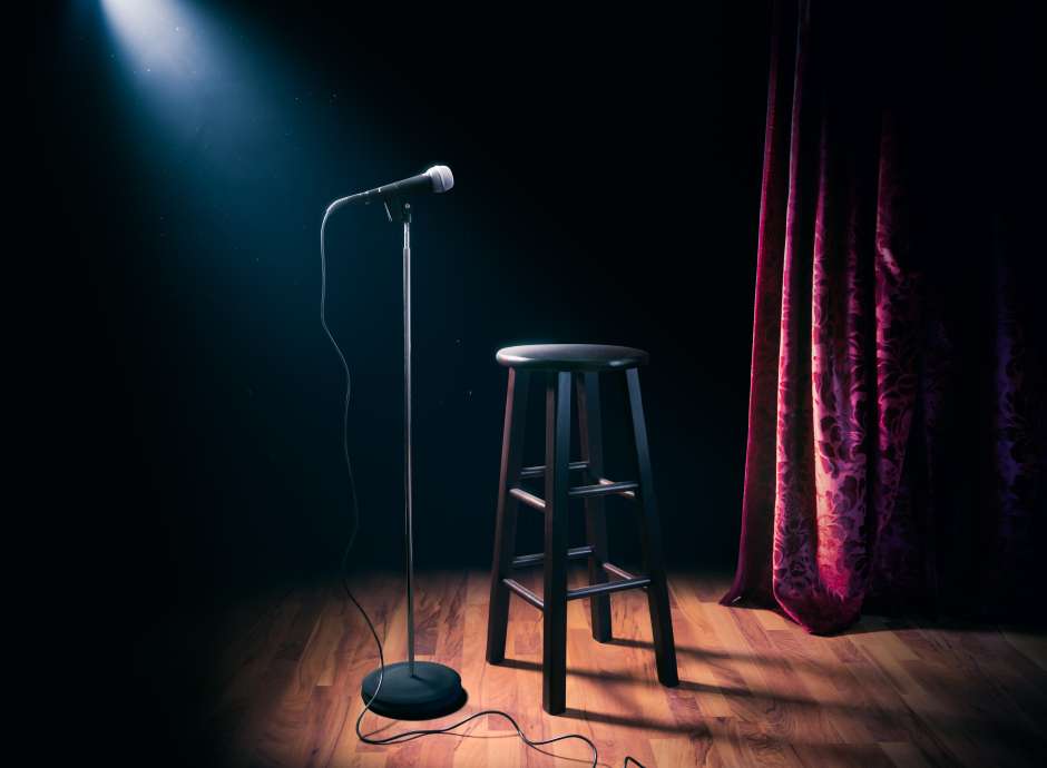 Seat on a stage with a mic