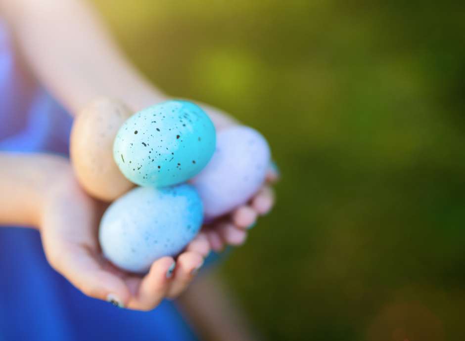Child holding Easter Eggs