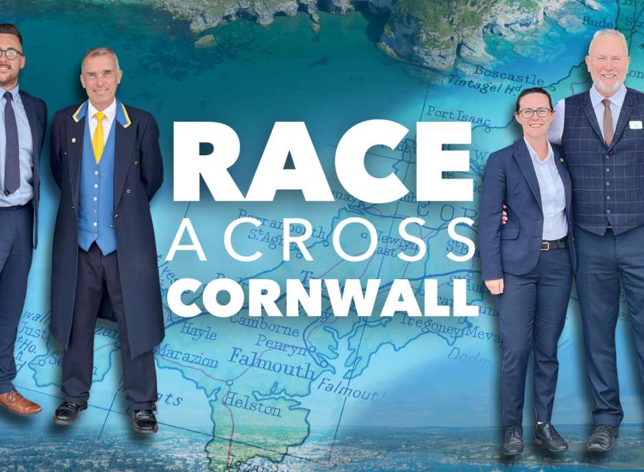 Staff at The Royal Duchy Hotel and The Carlyon Bay next to the Race Across Cornwall Text 