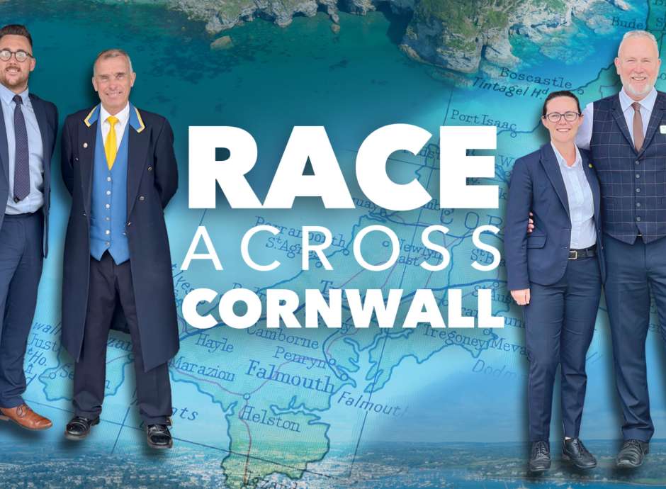 Staff at The Royal Duchy Hotel and The Carlyon Bay next to the Race Across Cornwall Text 