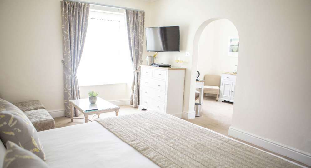 Royal Duchy Hotel Accommodation with Bed and Seating Area