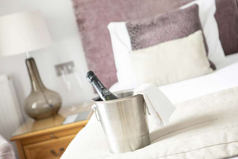 Royal Duchy Hotel Accommodation with Bucket of Champagne on Bed
