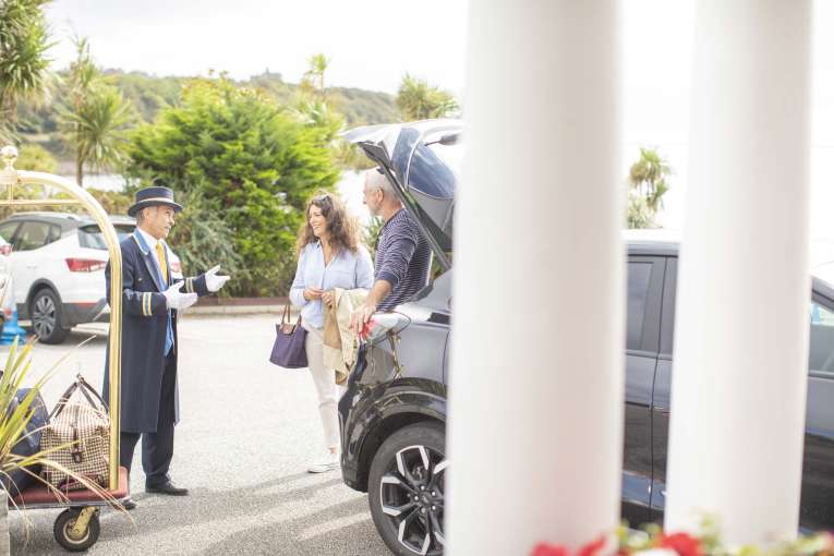 Royal Duchy Hotel Arriving Guests Greeted by Doorman Near Their Car