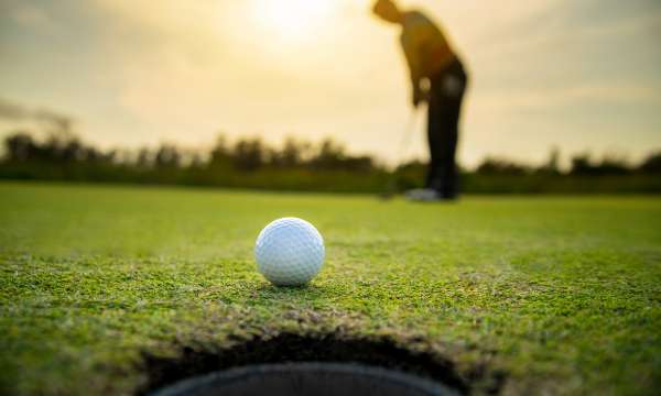 Close up of a golf ball on a green