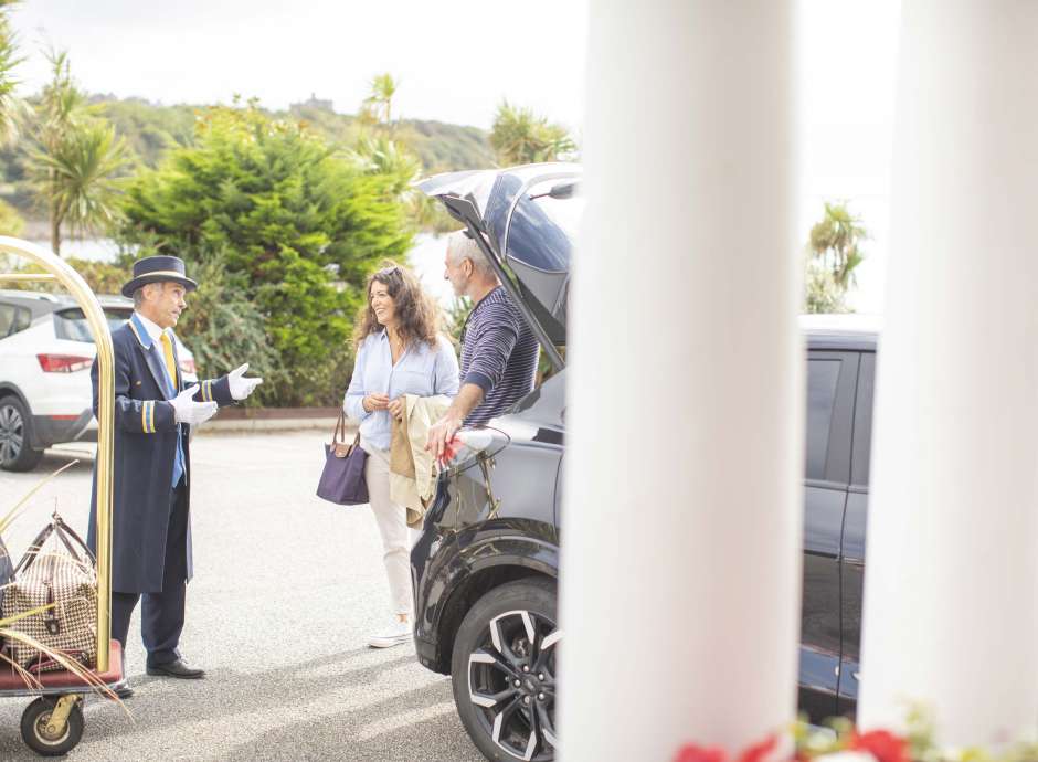 Royal Duchy Hotel Arriving Guests Greeted by Doorman Near Their Car