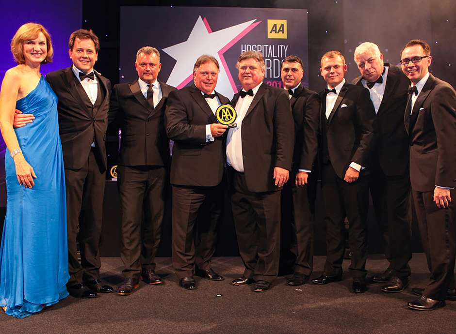 Brend directors at AA awards holding trophy 