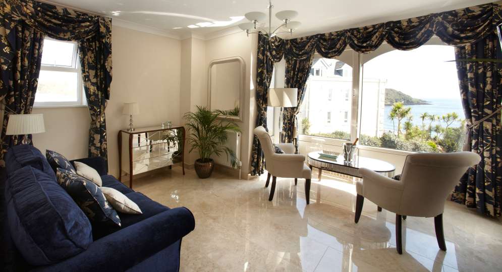 The luxurious lounge of the Armada Suite with sea view at The Royal Duchy Hotel in Cornwall